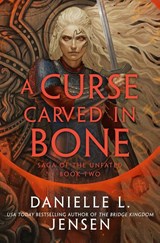 A Curse Carved in Bone - Danielle L. Jensen - 9780593599860