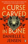 A Curse Carved in Bone - Danielle L. Jensen - 9781804947173