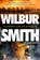 Vlammen aan de horizon, Wilbur Smith - Paperback - 9789401625104
