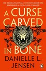A Curse Carved in Bone - Danielle L. Jensen - 9781804947173